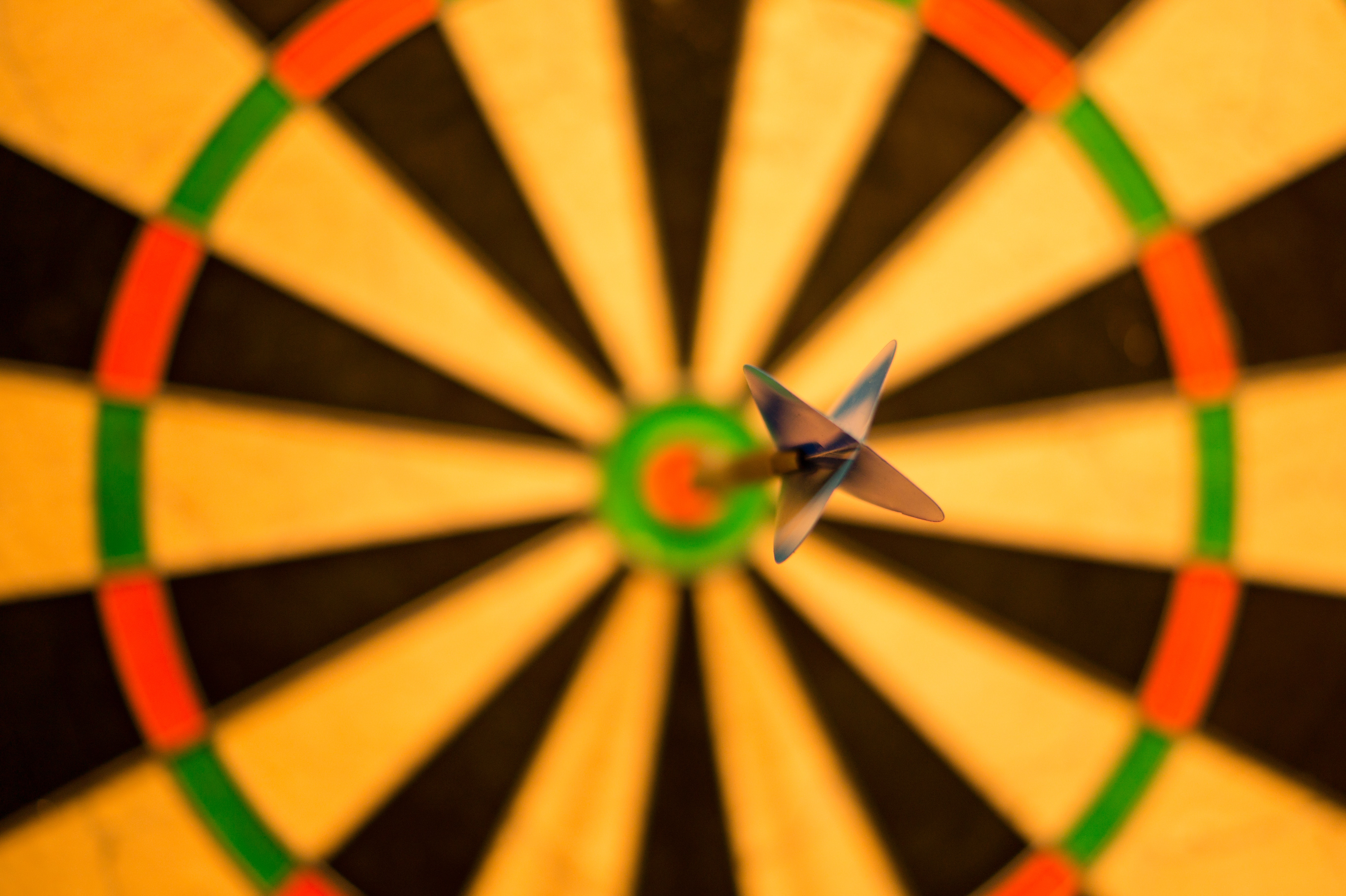 Image of a dart in the center of a dartboard
