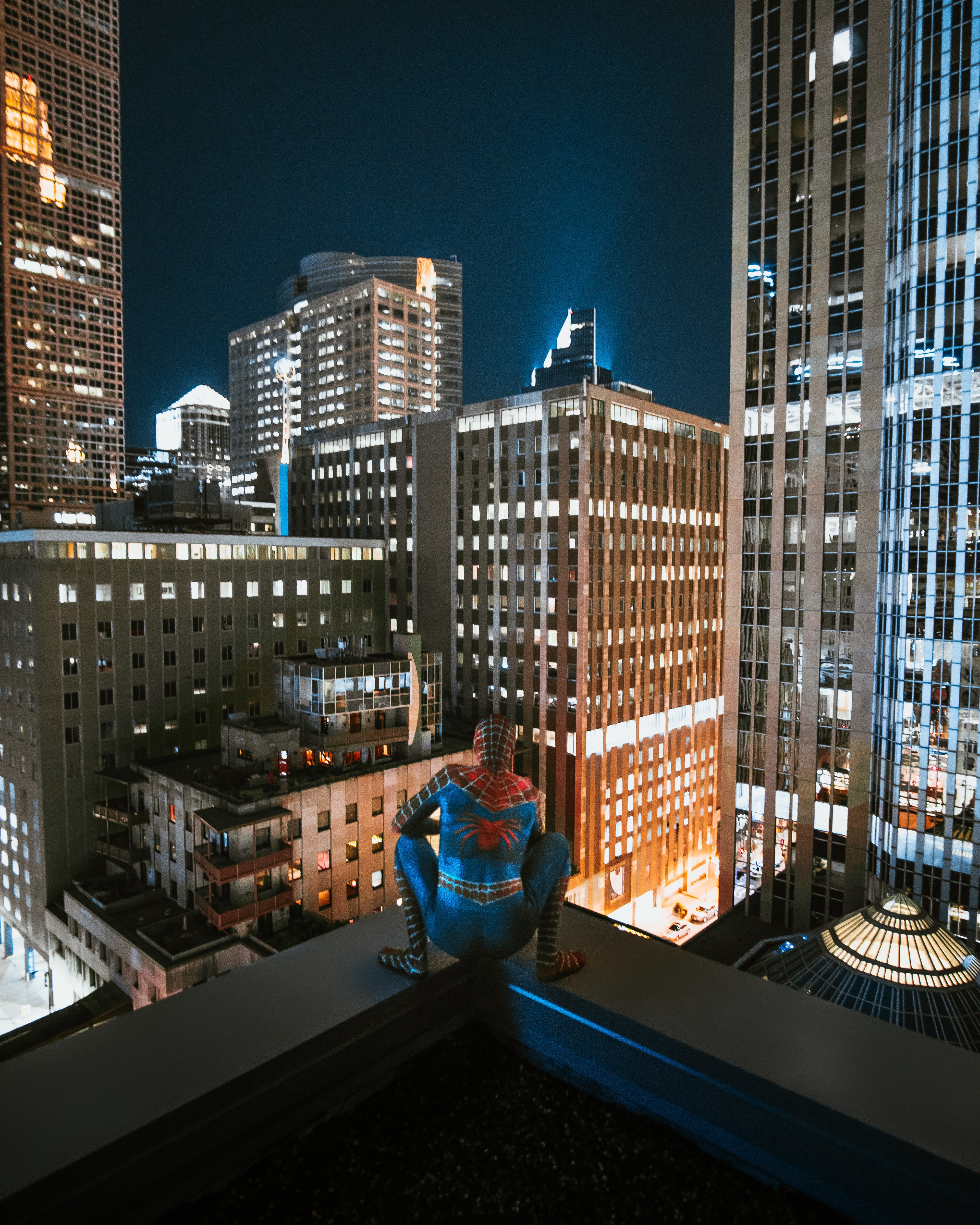 Image of Spiderman at the edge of a skyscraper
